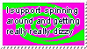 A stamp with the text 'I support spinning around and getting really really dizzy' ontop of a pink background with a green spiral