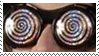 A stamp featuring an eyeshot of someone wearing large spiral glasses